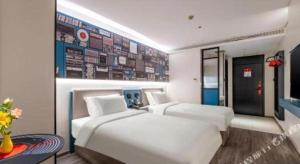 Katil atau katil-katil dalam bilik di 7 Days Inn Baoding Railway Station