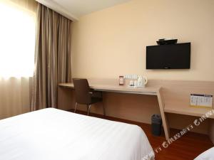 TV a/nebo společenská místnost v ubytování 7 Days Inn Yancheng Xiangshui Jinhai Road + 14 fotografií