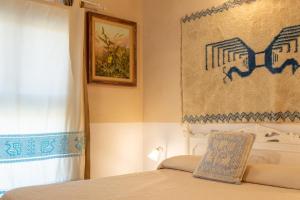 Postel nebo postele na pokoji v ubytování Is Perdas Rural Retreat & Spa