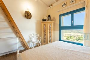 Postel nebo postele na pokoji v ubytování Is Perdas Rural Retreat & Spa