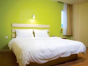 Una cama o camas en una habitación de 7 Days Inn Siping Xinhua Street 28 fotos más