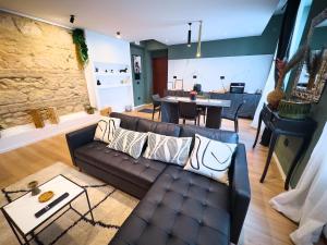 a living room with a couch and a table at Nishan 249 in Cosenza