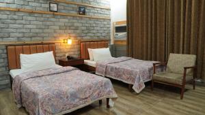 Park Hotel Gilgit客房内的一张或多张床位