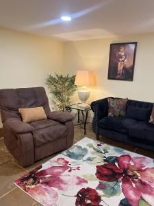 a living room with a couch and a chair at Grand Studio 56 in Faro +21 photos