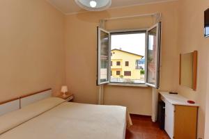 Postel nebo postele na pokoji v ubytování Hotel Costa d'Oro