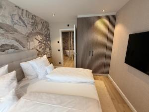 Postel nebo postele na pokoji v ubytování Das Oswald's Boutique Hotel