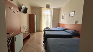Postel nebo postele na pokoji v ubytování Albergo Salerno + 37 fotografií