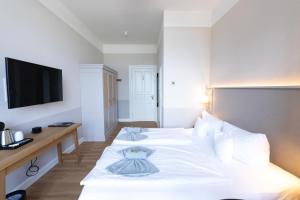 Postel nebo postele na pokoji v ubytování Hotel Germania