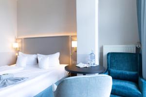 Postel nebo postele na pokoji v ubytování Hotel Germania