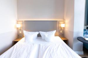 Postel nebo postele na pokoji v ubytování Hotel Germania