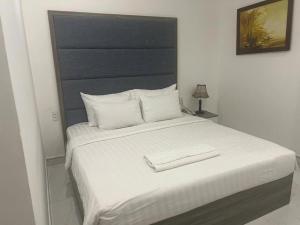 Postel nebo postele na pokoji v ubytování White Diamond Airport Hotel