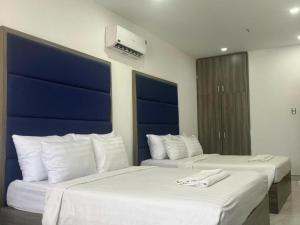 Postel nebo postele na pokoji v ubytování White Diamond Airport Hotel