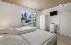 Postel nebo postele na pokoji v ubytování BEGE APARTMENTS FlexiStay