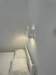 A bed or beds in a room at Agnàntema Portside Stays Skiathos