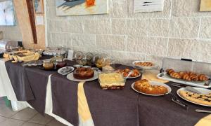 a table filled with food on top at Hotel La Vela in Isole Tremiti