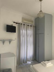 A bed or beds in a room at Agnàntema Portside Stays Skiathos