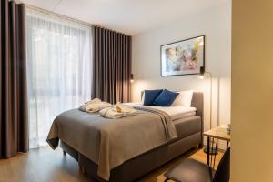 Postel nebo postele na pokoji v ubytování Hessnery Hotel