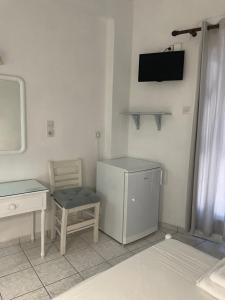 A television and/or entertainment centre at Agnàntema Portside Stays Skiathos