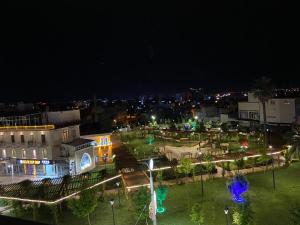 a park at night with lights in a city at Otel OrtaDoğu in Urfa