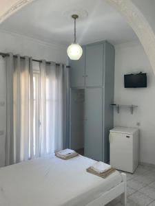 A bed or beds in a room at Agnàntema Portside Stays Skiathos