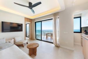 a living room with a view of the ocean at Arlequin Suites in Marbella