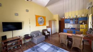 a living room with a couch and a dining room at Vila Bine in Splitska