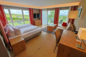Postel nebo postele na pokoji v ubytování Hotel Rebenhof