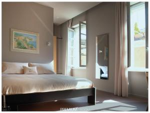 a bedroom with a bed and a window at San Paolo Design Suites in Piacenza