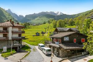 an aerial view of a village with mountains in the background at Boutique Apartment Limone Ski In Ski Out - Happy Rentals in Limone Piemonte +20 photos
