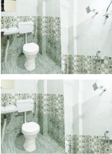 a bathroom with two sinks and a toilet at The Petra in Jaipur