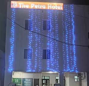 a hotel with blue lights on the side of it at The Petra in Jaipur