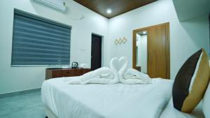 Periyar Vibes Private Pool Villa客房内的一张或多张床位