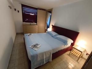Postel nebo postele na pokoji v ubytování La casa di Arianna