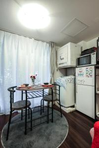 Kuchyň nebo kuchyňský kout v ubytování North Cottage Studio Apartment with private entrance