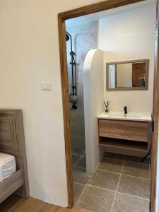 a bathroom with a sink and a shower at Chalong Home Phuket in Phuket