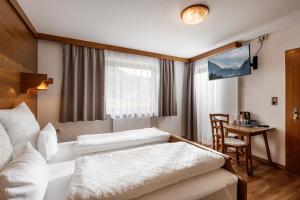 Postel nebo postele na pokoji v ubytování Gästehaus Berta