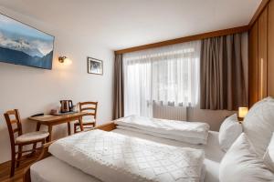 Postel nebo postele na pokoji v ubytování Gästehaus Berta