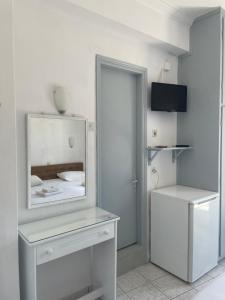 A television and/or entertainment centre at Agnàntema Portside Stays Skiathos