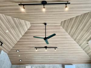 a clock on the ceiling of a room at 恩納村リゾート貸別荘 COCO PLUS No2 in Onna