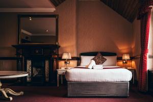 Postel nebo postele na pokoji v ubytování Russell Court Hotel