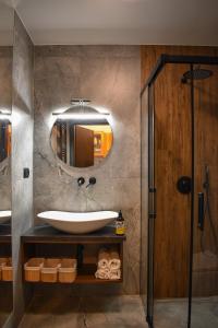 a bathroom with a sink and a mirror at Czerwona Ławka in Zakopane
