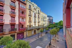 an empty street in a city with colorful buildings at Maturana by Clabao in Logroño
