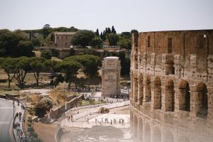 a view of the ruins of the coliseum at Colosseo Deluxe YH in Rome