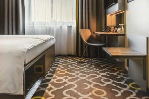 Postel nebo postele na pokoji v ubytování Qubus Hotel Żory