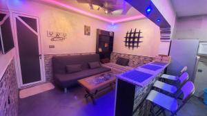 a living room with a couch and a table at wunderschöne Wohnung in Imi Ouaddar in Agadir nʼ Aït Sa