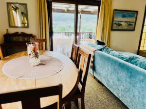 a living room with a table and a couch at Sedgefield Vacation Home in Sedgefield