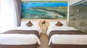 Postel nebo postele na pokoji v ubytování Apec Mandala Whyndham Spa Hotel Tuy Hoa Phu Yen + 36 fotografií