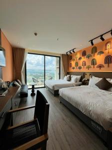 Postel nebo postele na pokoji v ubytování Apec Mandala Whyndham Spa Hotel Tuy Hoa Phu Yen