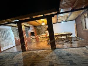 a room with a picnic table in a building at Cole si Denisa in Beclean
