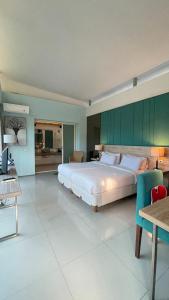 En eller flere senge i et værelse på Bougenvilla Nusa Dua Bali + 37 billeder